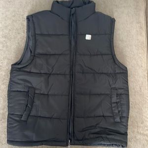 Burnside Puffer vest. SUPERBOWL LVII FOX logo on back. Color- black. Size Large